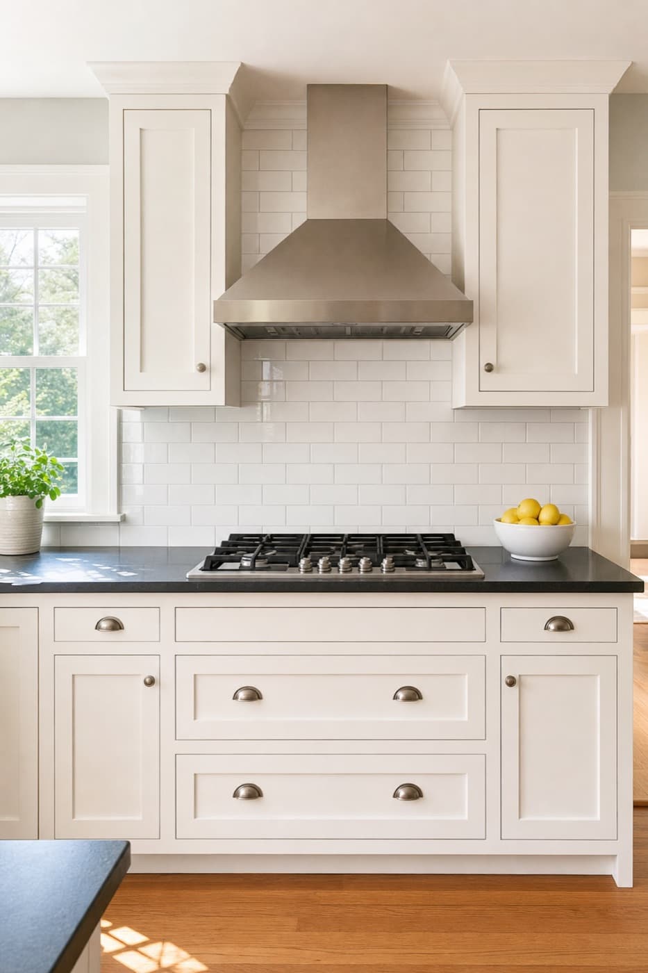 Spotless white kitchen with a gleaming gas stovetop